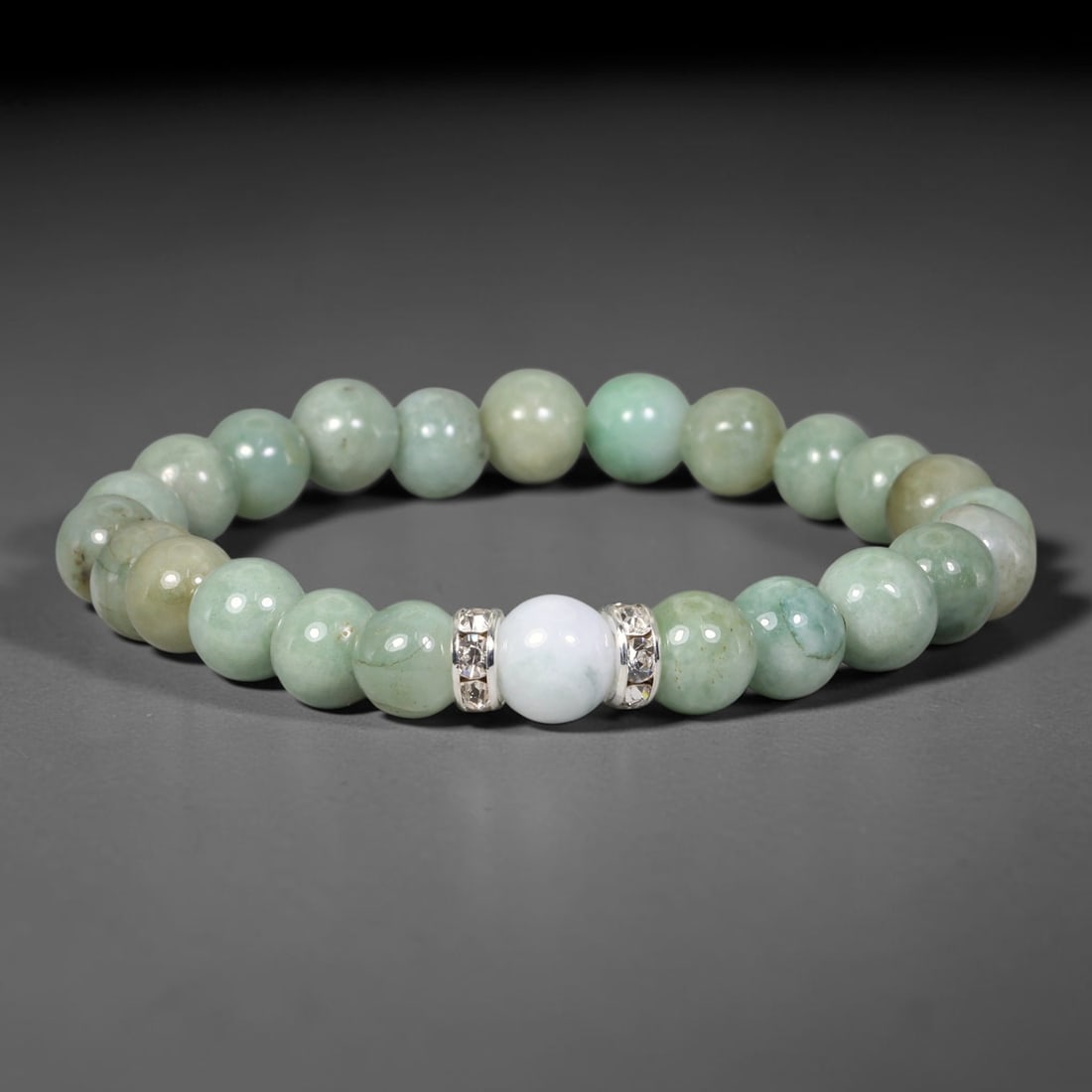 Natural Burmese Type A Jadeite Jade Beaded Bracelet, 35EP: Polished natural jadeite jade round beads complemented by decorative crystal spacer accents. Uniform 8mm beads form a flexible wearable strand. A timeless gemstone bracelet suitable for daily styling,