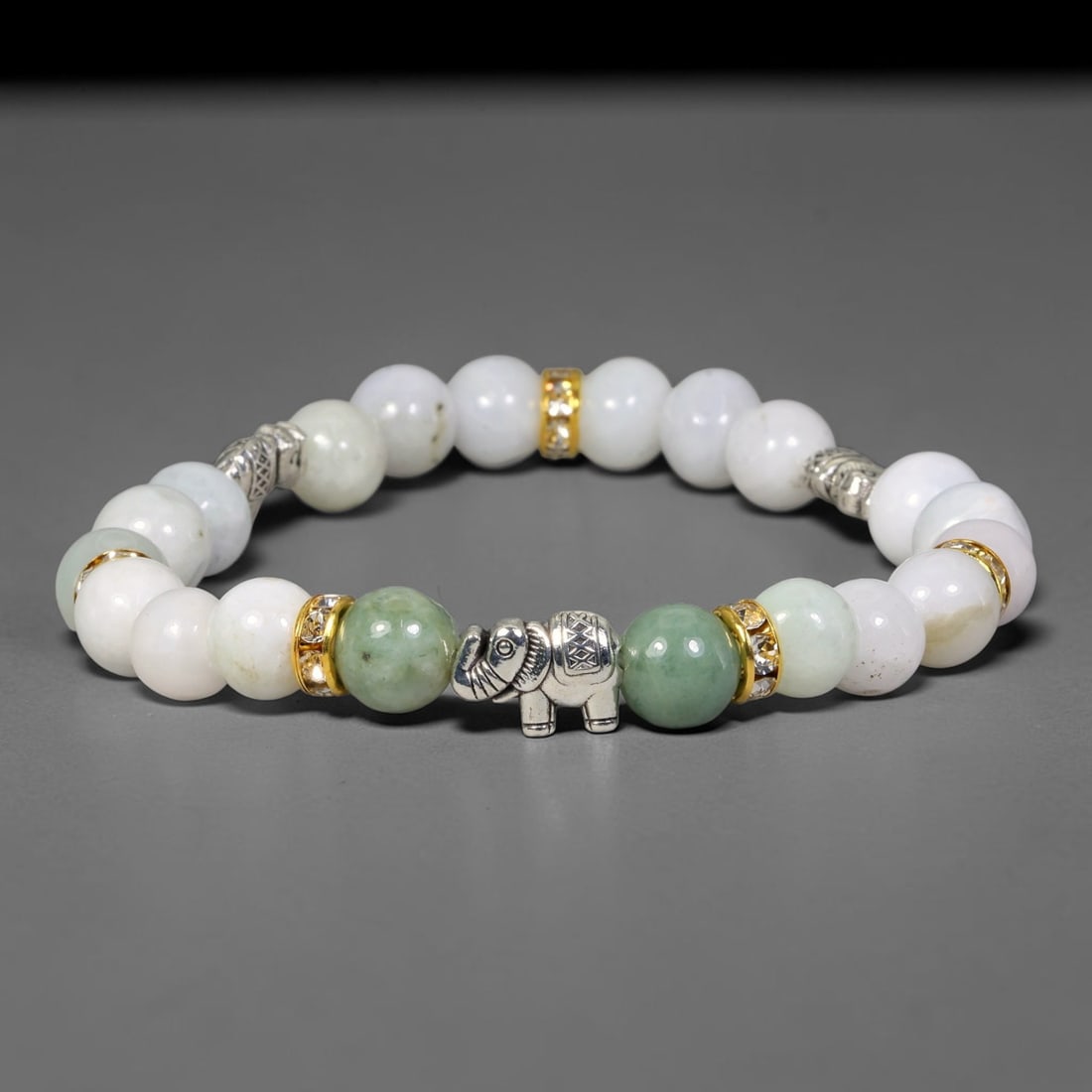 Natural Burmese Type A Jadeite Jade Beaded Bracelet, 29EP: Polished natural jadeite jade round beads complemented by decorative crystal spacer accents. Uniform 8mm beads form a flexible wearable strand. A timeless gemstone bracelet suitable for daily styling,