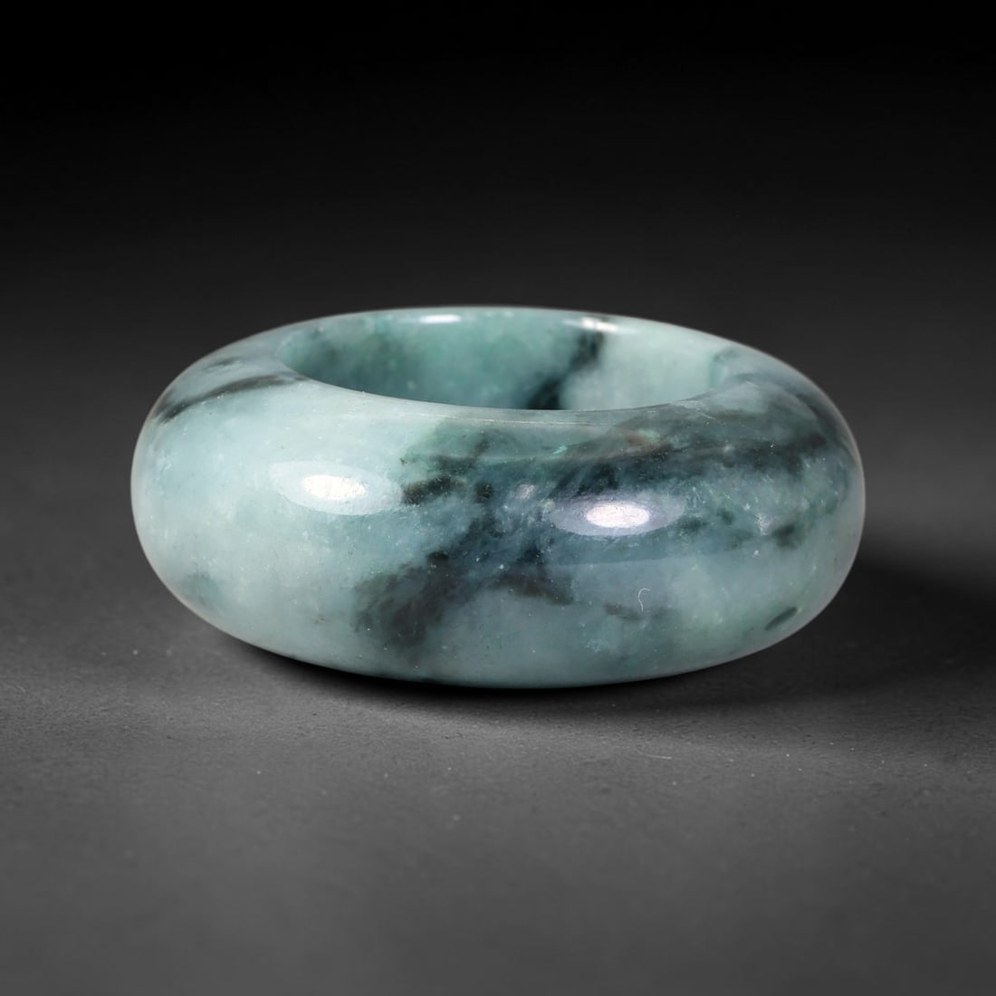 Natural Burmese Type A Jadeite Jade Wide Band Ring, 8BK: Polished untreated Burmese Type A jadeite jade wide band ring, US ring size 13 with a substantial band width of 14 mm. The jadeite features a soft pale mint green base naturally streaked with flowing 