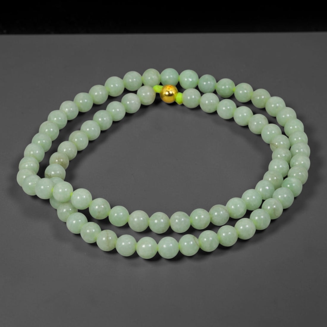 Natural Burmese Type A Jadeite Jade Round Bead Necklace with Gold Gilt Accent Bead, 13BL: Elegant hand-strung necklace made from polished natural untreated Burmese Type A jadeite jade spherical beads, each bead measuring 8 mm in diameter. The jadeite features a soft pale milky celadon hue 