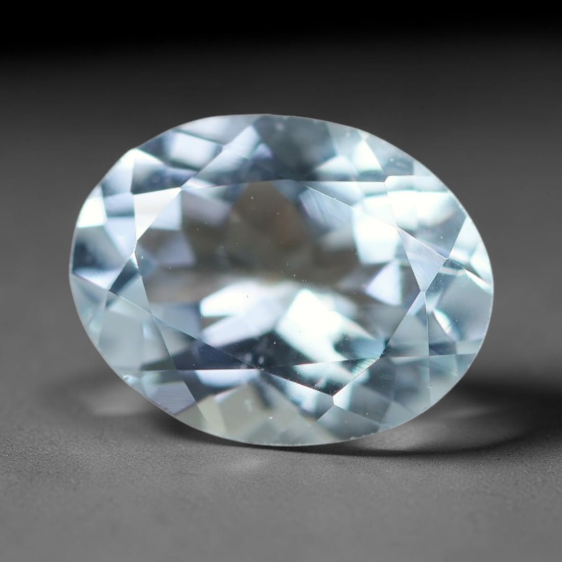 1.61ct Natural Brazilian Sky Blue Faceted Aquamarine Loose Gemstone, 12BC: This precisely faceted aquamarine boasts clear translucent pale sky blue body tone with subtle thin mineral needle and tiny scattered crystalline specks visible within its polished reflective planes i