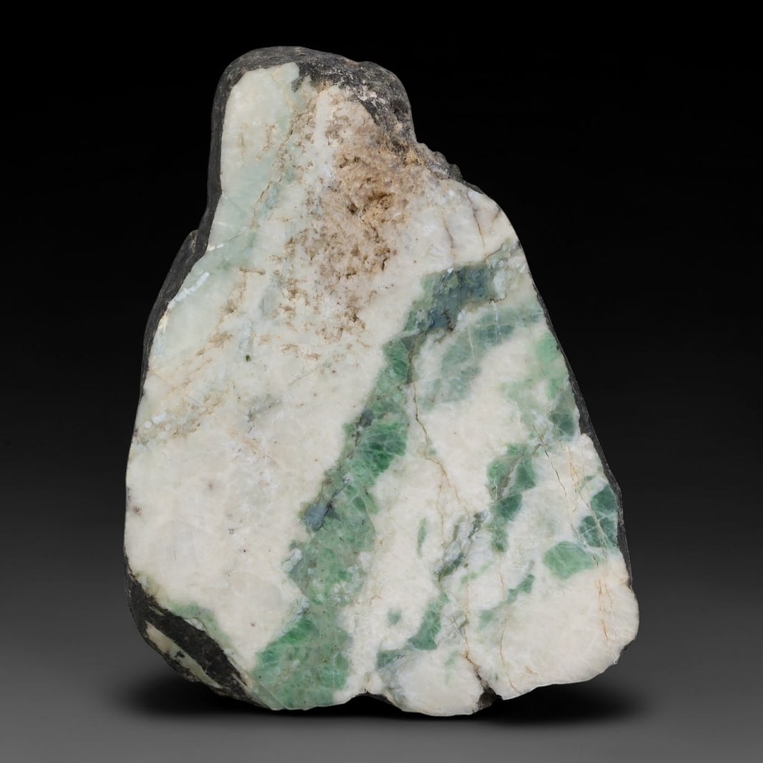 325ct Natural Type A Burmese Jadeite Jade Sliced Rough, 57AZ: This specimen is a sliced rough block of natural Type A Burmese jadeite jade. The interior displays natural colour zoning with visible mineral veining and crystalline patterns typical of unprocessed j