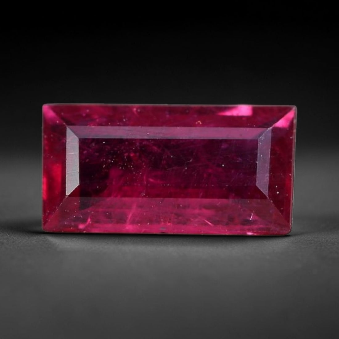 0.88 Carats Natural Madagascar Vivid Fuchsia Red Heated Ruby Loose Gemstone, 56FM: This vivid fuchsia red Madagascar ruby displays rich saturated red tone with subtle natural internal mineral traces that showcase genuine earth-grown character, measured at 7.7x4x2.4mm, the intense wa