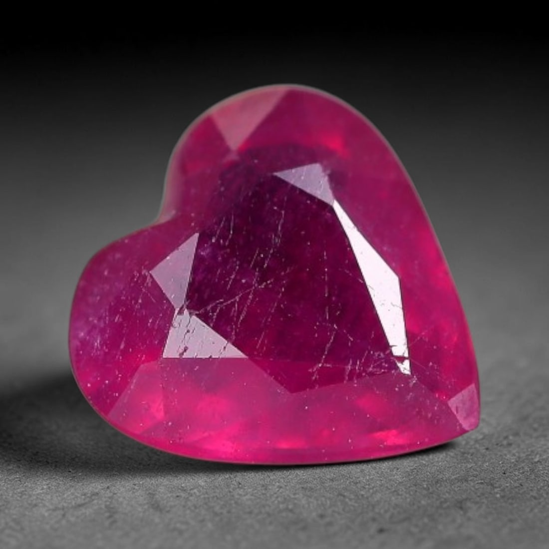 1.31 Carats Natural Madagascar Vivid Fuchsia Red Heated Ruby Loose Gemstone, 52FM: This vivid fuchsia red Madagascar ruby displays rich saturated red tone with subtle natural internal mineral traces that showcase genuine earth-grown character, measured at 7x3.3mm, the intense warm c