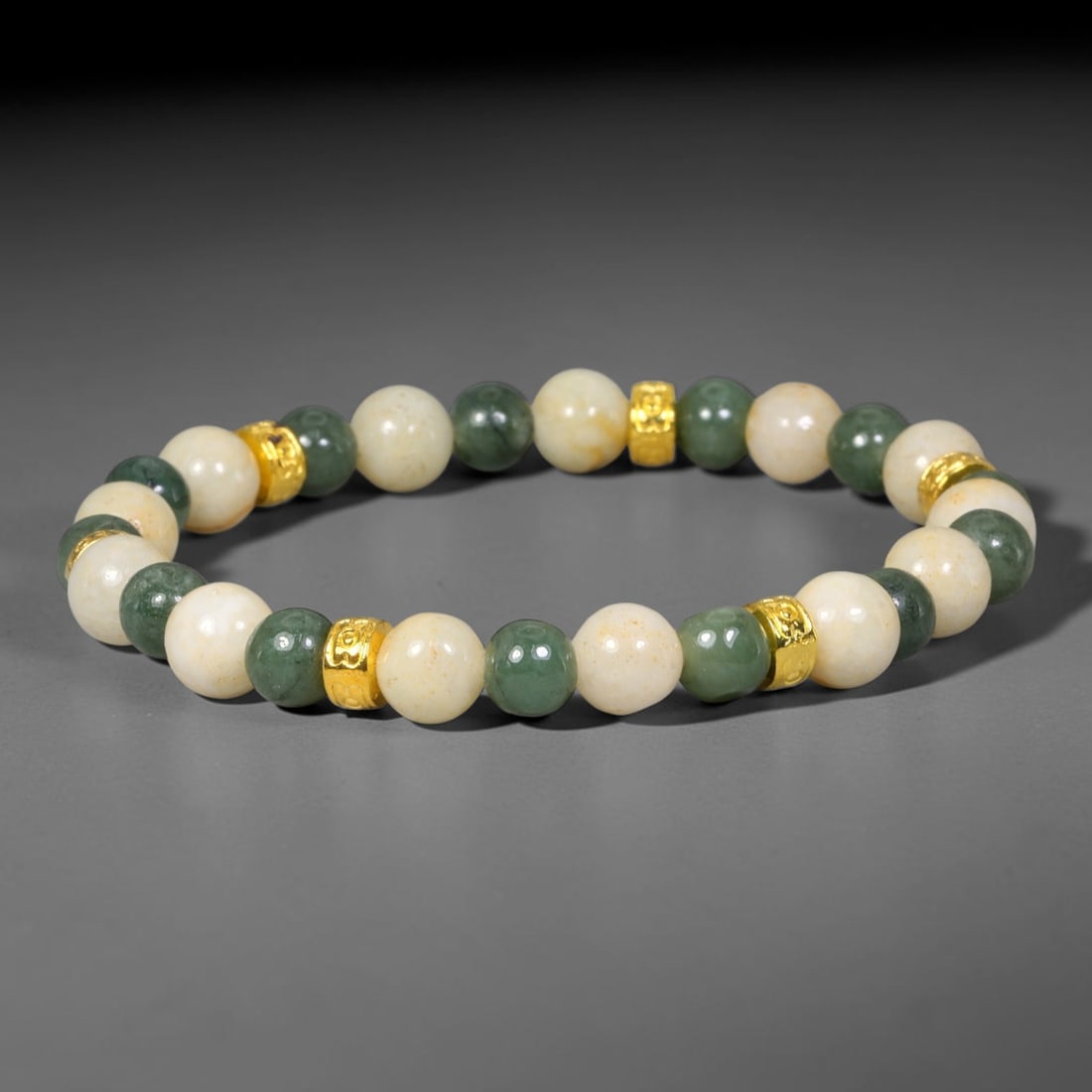 Natural Burmese Type A Jadeite Jade Beaded Bracelet, 31EP: Polished natural jadeite jade round beads complemented by decorative crystal spacer accents. Uniform 8mm beads form a flexible wearable strand. A timeless gemstone bracelet suitable for daily styling,