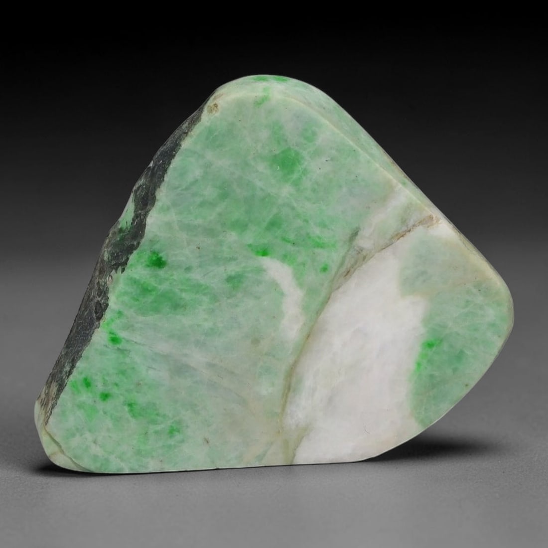 137ct Natural Type A Burmese Jadeite Jade Sliced Rough, 44AZ: This specimen is a sliced rough block of natural Type A Burmese jadeite jade. The interior displays natural colour zoning with visible mineral veining and crystalline patterns typical of unprocessed j
