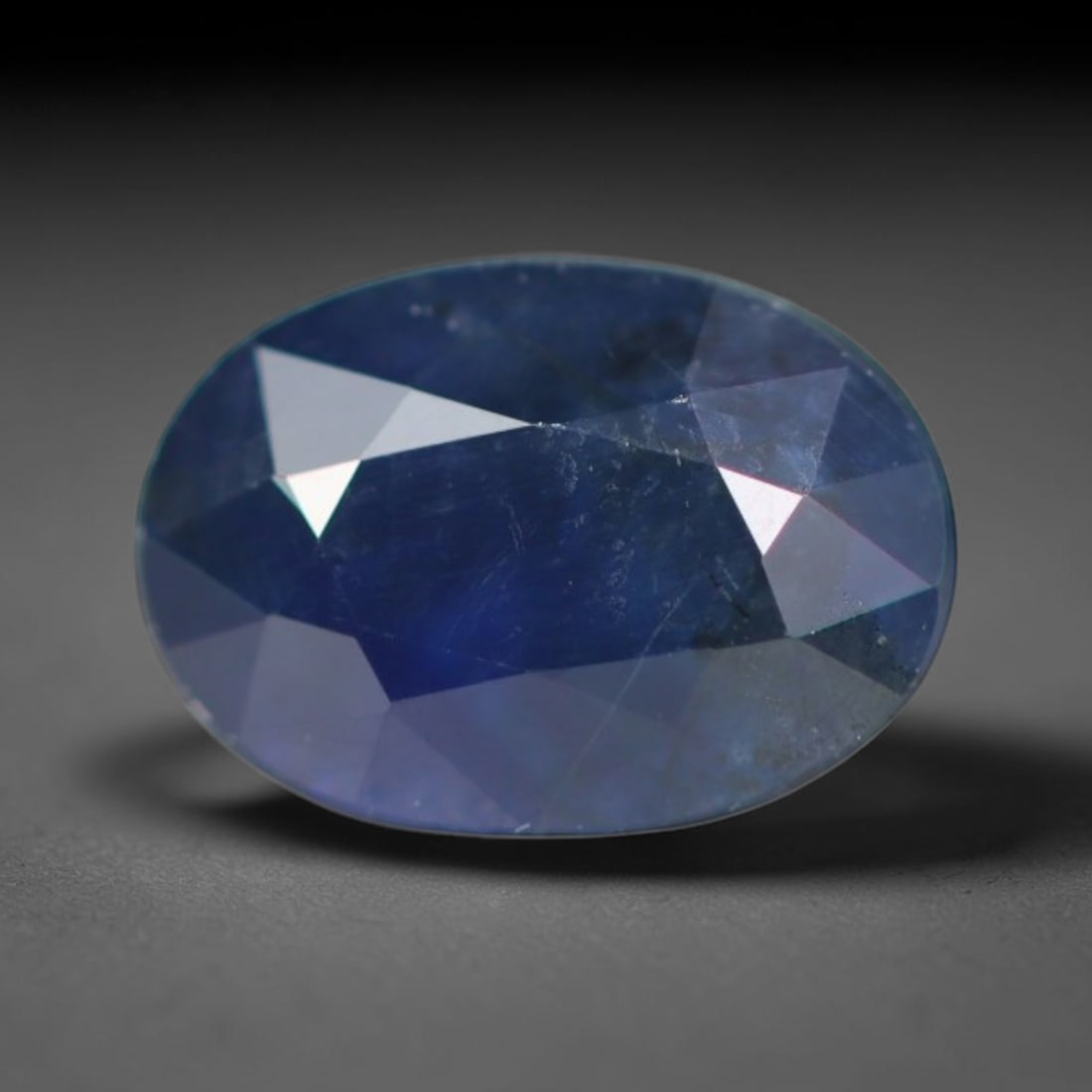 0.91ct Natural Ceylon Rich Royal Blue Faceted Blue Sapphire Loose Gemstone, 40BC: This fully polished finished sapphire displays rich saturated royal blue body tone, with fine natural microscopic mineral specks scattered throughout its transparent crystal interior within its 6.8x4.