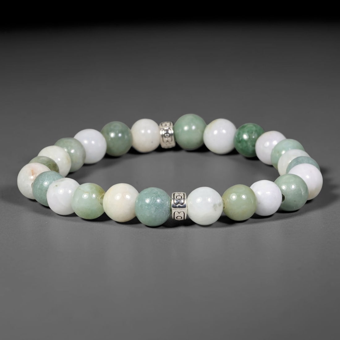 Natural Burmese Type A Jadeite Jade Beaded Bracelet, 37EP: Polished natural jadeite jade round beads complemented by decorative crystal spacer accents. Uniform 8mm beads form a flexible wearable strand. A timeless gemstone bracelet suitable for daily styling,