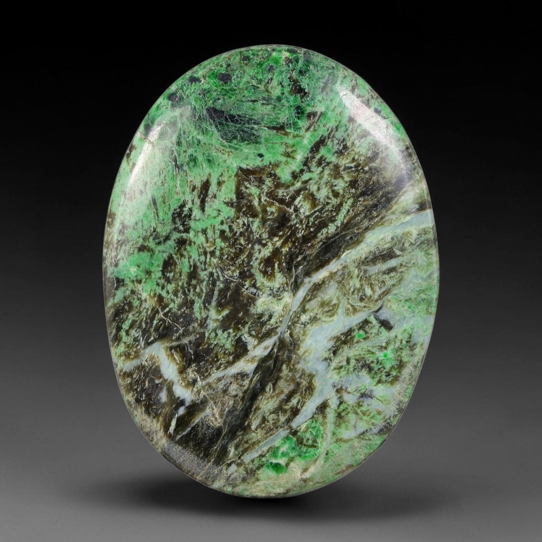 17ct Natural Burmese Type A Moss Green Mountain Scenic Jadeite Jade Cabochon, 33FA: This single untreated natural Burmese Type A oval jadeite jade cabochon weighs 17ct with dimensions of 28.8x21.2x3.4mm. The earthy brown fibrous host rock is mixed with patches of vivid moss green, in
