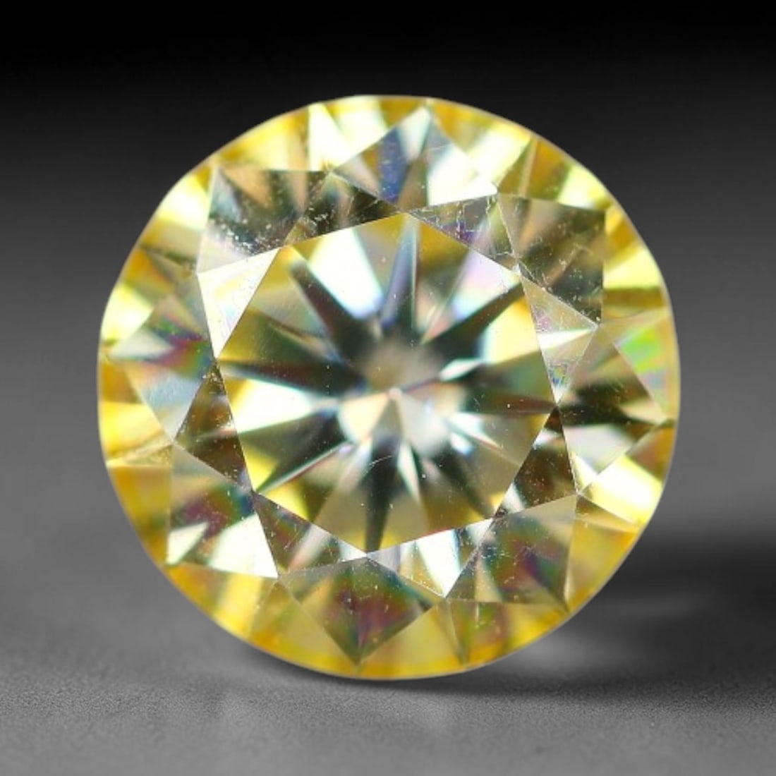 0.95 Carats Natural Golden Yellow Moissanite Loose Gemstone, 99FM: This golden yellow moissanite features dimensional measurements of 6.3x3.9mm, lab-crafted silicon carbide boasting extraordinary refractive power that produces intense, multi-tonal rainbow brilliance 