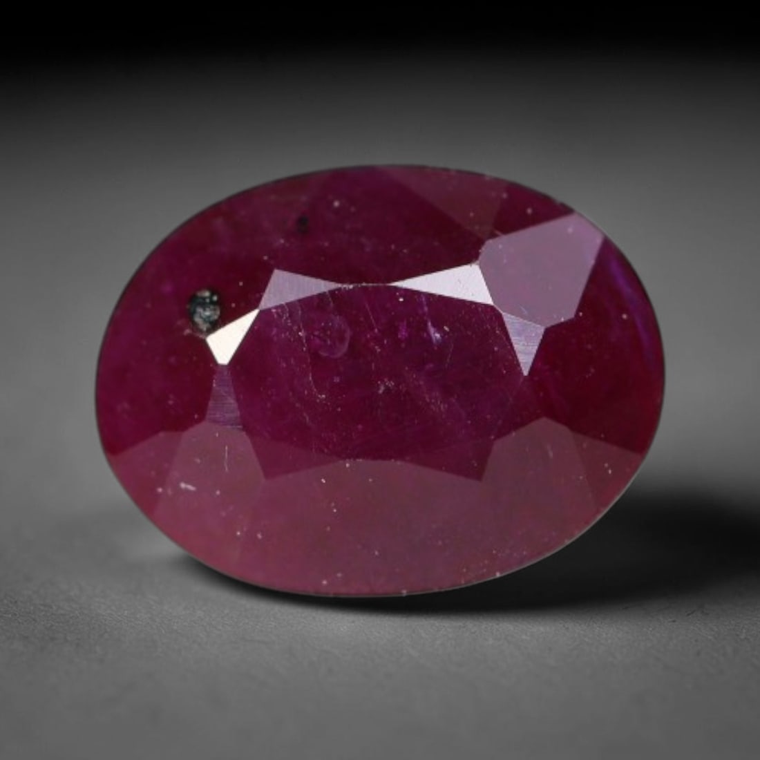 1.06ct Natural Tanzanian Longido Deep Crimson Red Faceted Ruby Loose Gemstone, 84BC: This expertly faceted Longido ruby features a rich deep crimson red body tone with distinct natural linear mineral striations, scattered pale mineral deposits and minor dark mineral flecks visible wit