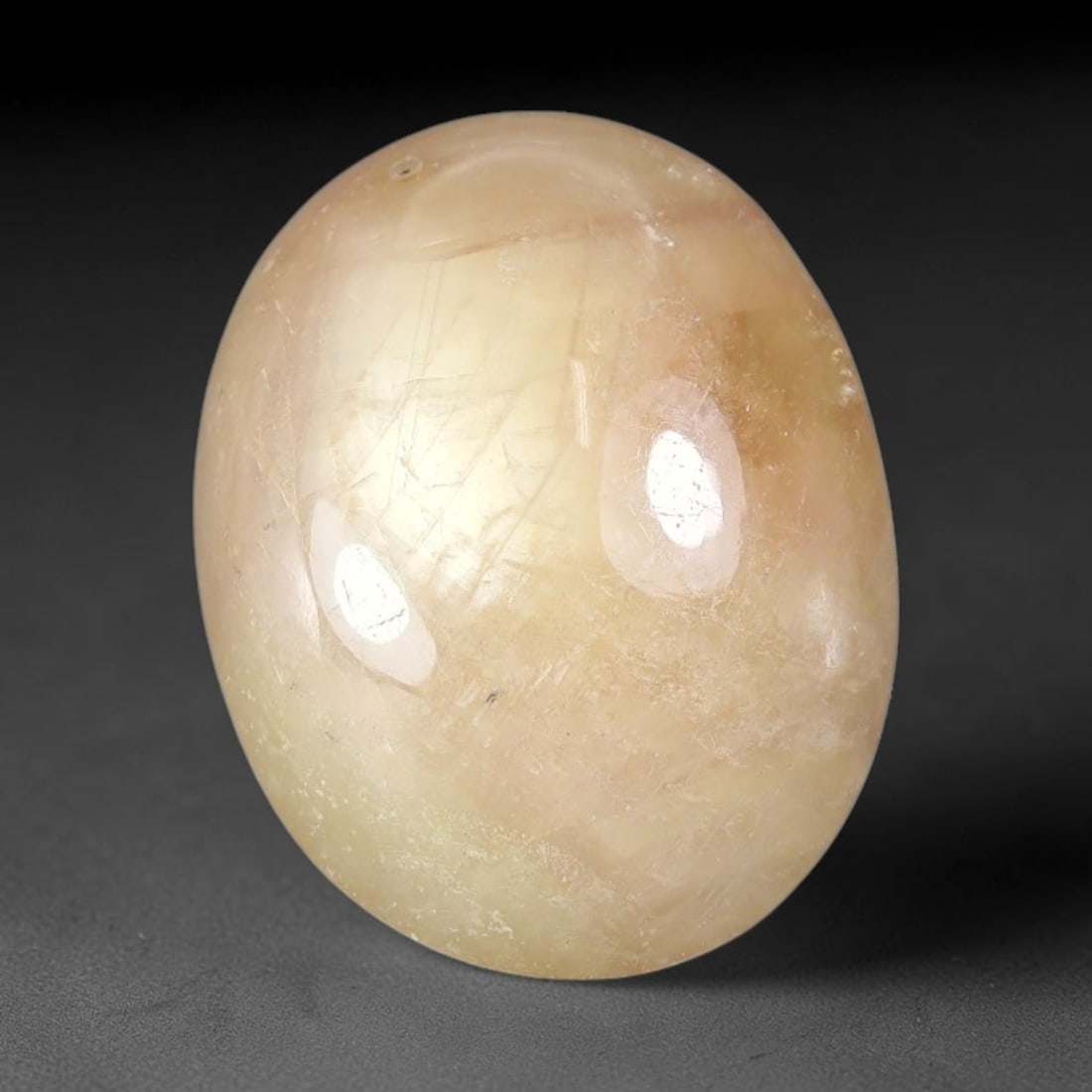 11.65 Carats Natural Madagascar Soft Rose Pink Heated Ruby Cabochon Loose Gemstone, 76FE: This warm blush-toned ruby cabochon carries blended swathes of soft rose pink and gentle peach undertones, with faint natural mineral veining throughout the polished dome, measured at 15.7x13.2x5.8mm.