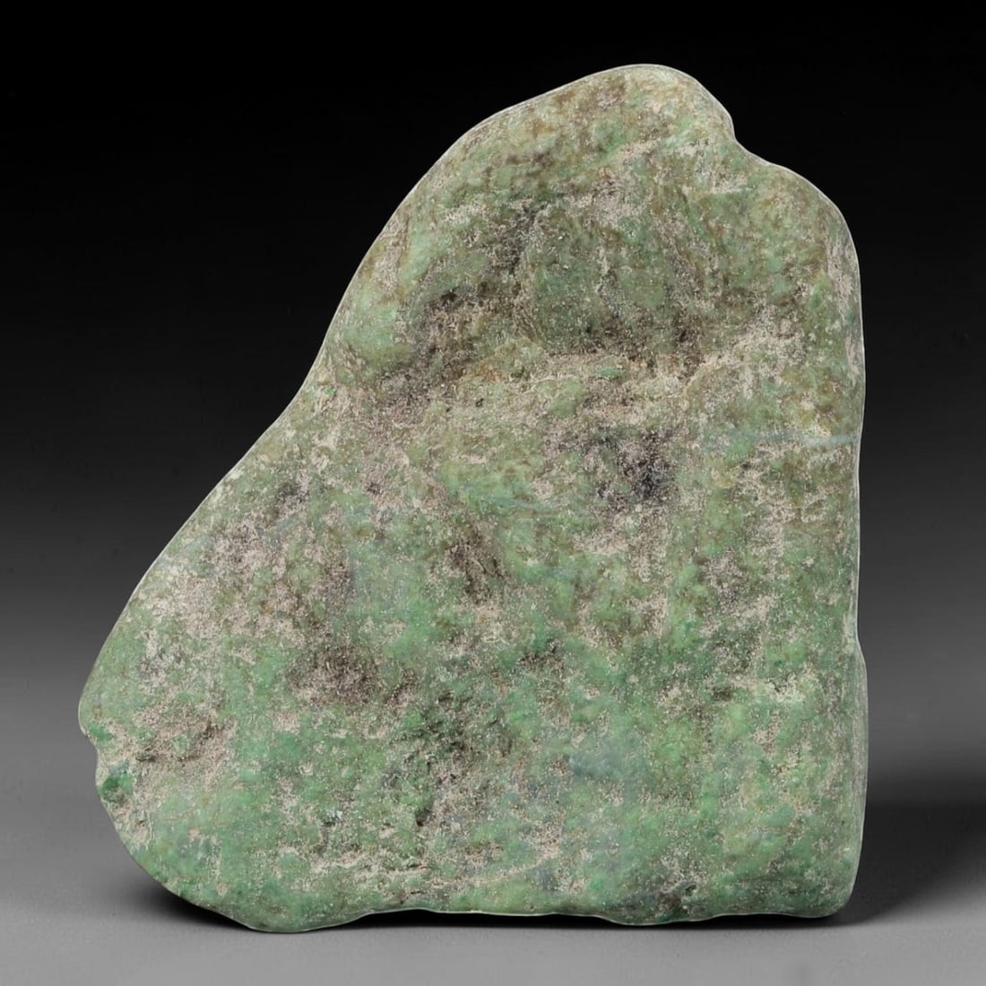180Ct Natural Type A Burmese Jadeite Jade Rough Stone - Green Raw Materialc, 38EA: This is a natural, unpolished rough stone of Type A Burmese jadeite jade, weighing 180 carats and measuring 4.5x3.5cm. The stone features a muted green base with natural mineral deposits, subtle tonal