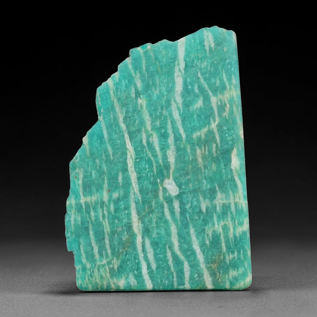 75ct Natural Russian Ural Amazonite Slab Rough, 80EB: This intact amazonite slab features distinct parallel mineral banding running uniformly across its naturally split flat surface within 33x29x6mm slab dimensions, retaining unmodified natural geologica