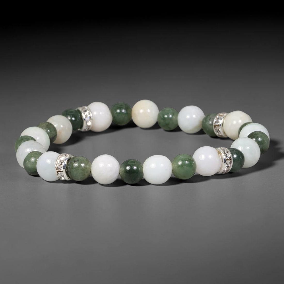 Natural Burmese Type A Jadeite Jade Beaded Bracelet, 33EP: Polished natural jadeite jade round beads complemented by decorative crystal spacer accents. Uniform 8mm beads form a flexible wearable strand. A timeless gemstone bracelet suitable for daily styling,