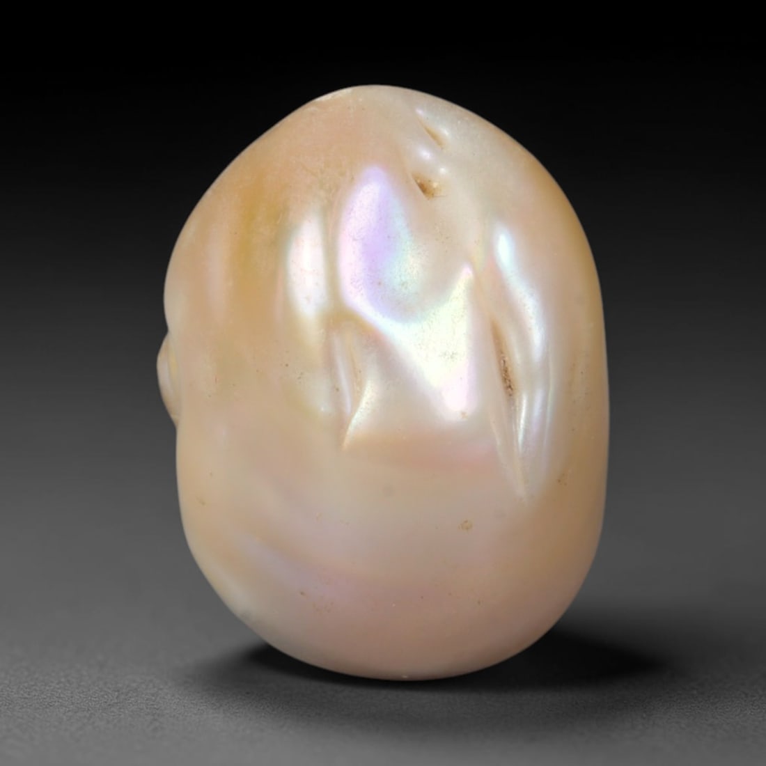 Natural Freshwater Keshi Pearl - Iridescent Baroque Pearl Ornament, 46AE: A natural freshwater keshi pearl with organic asymmetrical baroque shaping, exhibiting soft creamy blush base tones with shifting pastel pink, lavender and pale gold iridescent luster across its smoot