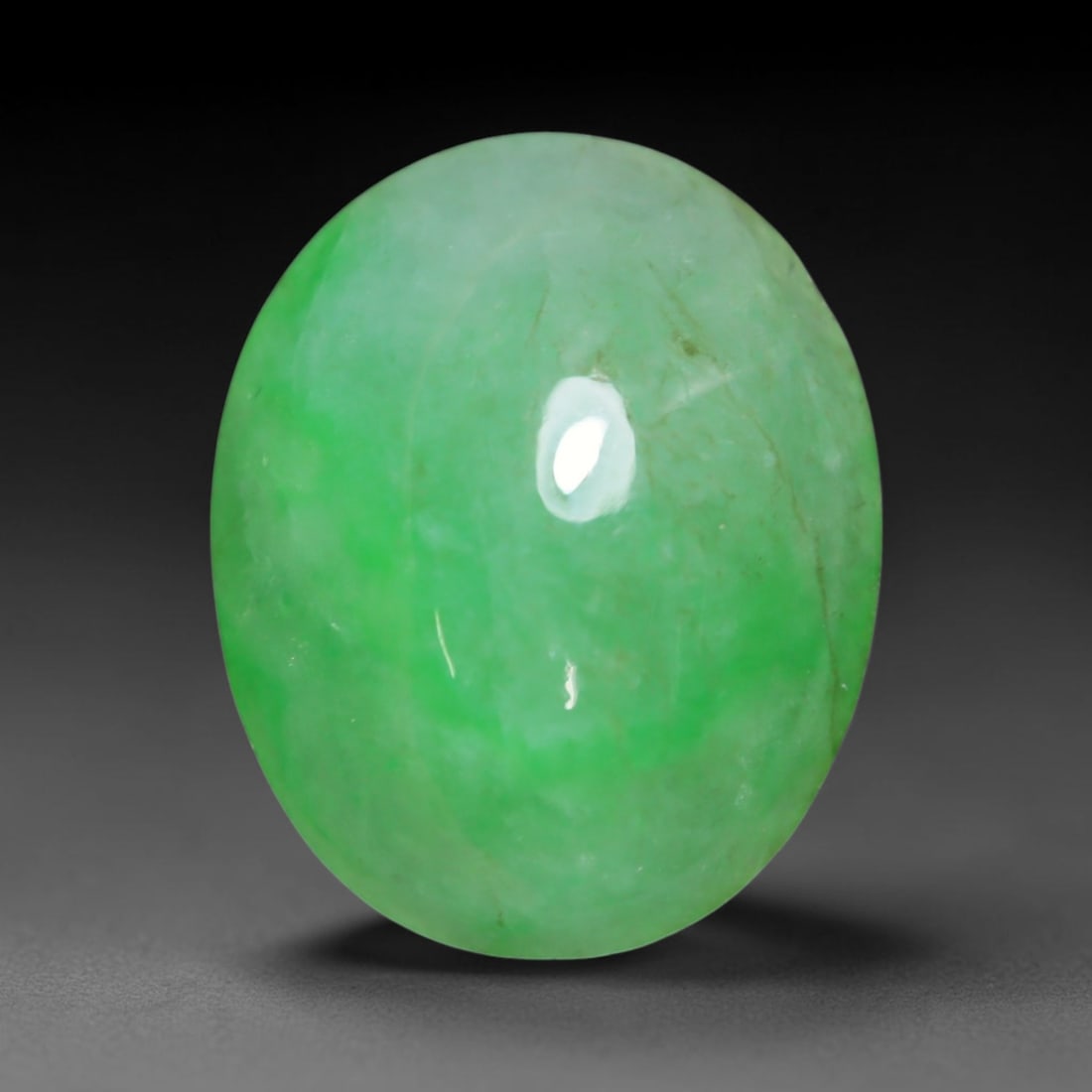 3.92ct Natural Burmese Type A Jadeite Jade Cabochon Loose Gemstone, 44BT: This smoothly polished cabochon is genuine Type A Burmese jadeite jade. It displays soft, even green saturation with gentle natural tonal variation across the polished surface, featuring a fine compac