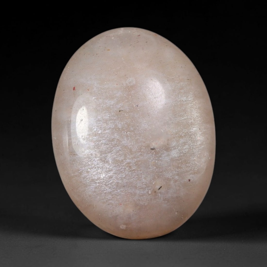 14.91 Carats Natural Ceylon Soft Peach Pink Moonstone Cabochon Loose Gemstone, 98AB: This warm soft peach pink moonstone features delicate sparkling mineral flecks scattered throughout its smooth surface paired with faint flowing adularescent glow, measured at 20x15.2x6.2mm, its gentl