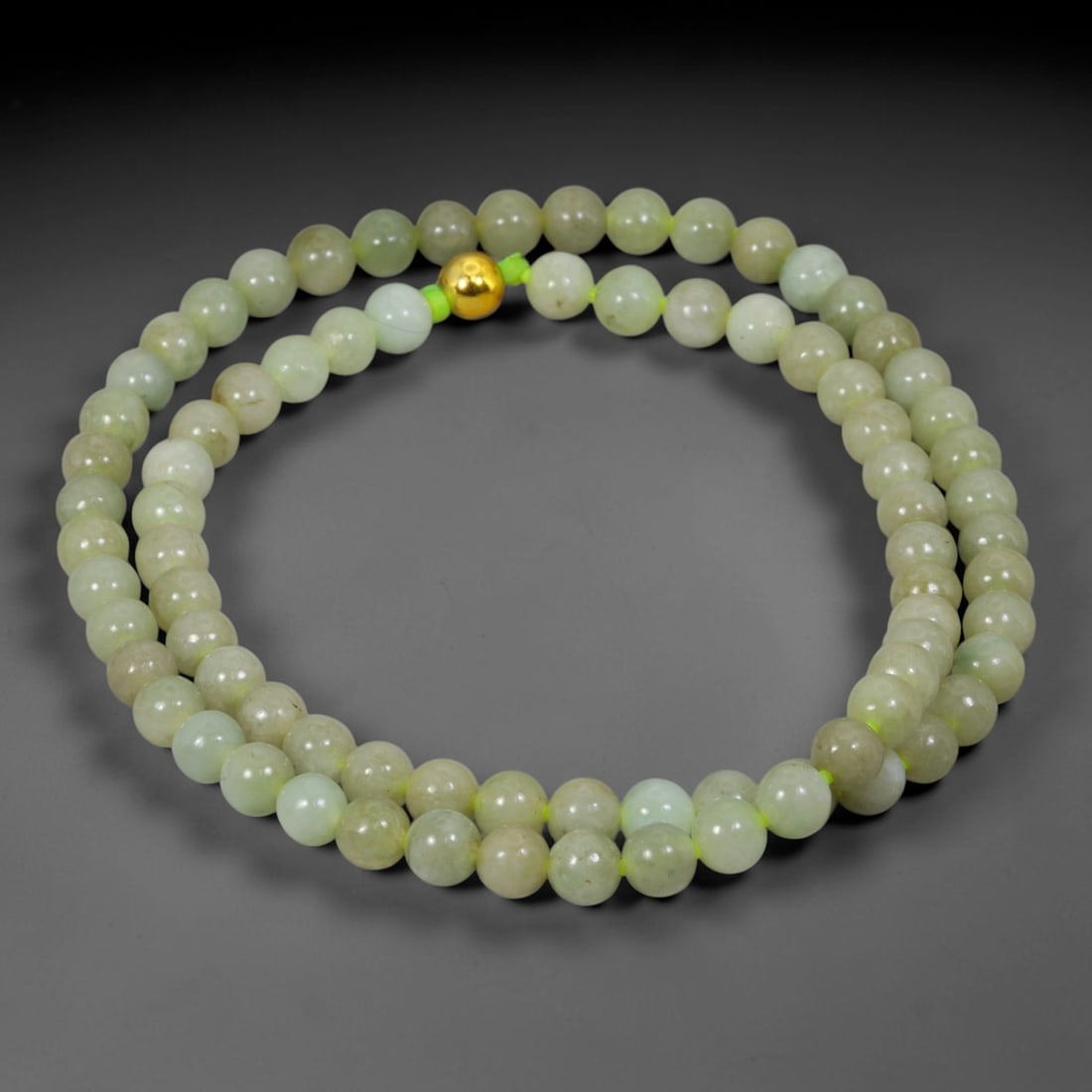 Natural Burmese Type A Jadeite Jade Round Bead Necklace with Gold Gilt Accent Bead, 4BL: Elegant hand-strung necklace made from polished natural untreated Burmese Type A jadeite jade spherical beads, each bead measuring 8 mm in diameter. The jadeite features a soft pale milky celadon hue 