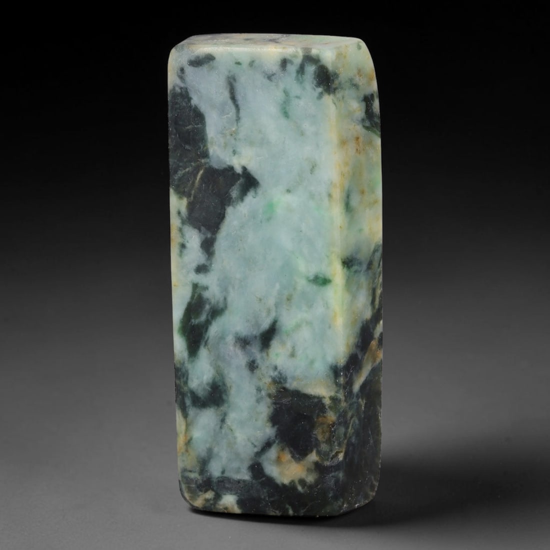 223ct Natural Type A Burmese Jadeite Jade Sliced Rough, 5FB: This specimen is a sliced rough block of natural Type A Burmese jadeite jade. The interior displays natural colour zoning with visible mineral veining and crystalline patterns typical of unprocessed j