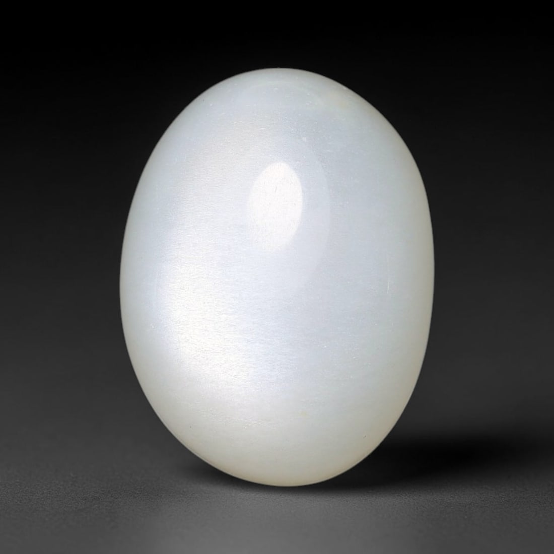 11.00ct Natural Ceylon White Moonstone Cabochon Loose Gemstone, 3FY: This natural Ceylon moonstone cabochon carries a milky white body showcasing classic adularescence. Fine mineral inclusions are visible within the gem. Dimensions measure 15x11x7mm, mined in Sri Lanka