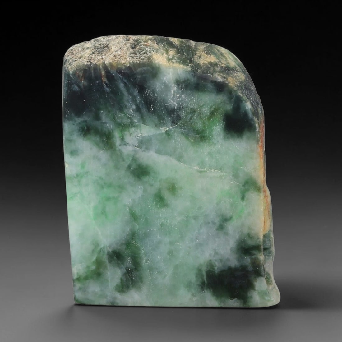 225ct Natural Type A Burmese Jadeite Jade Sliced Rough, 59FD: This specimen is a sliced rough block of natural Type A Burmese jadeite jade. The interior displays natural colour zoning with visible mineral veining and crystalline patterns typical of unprocessed j