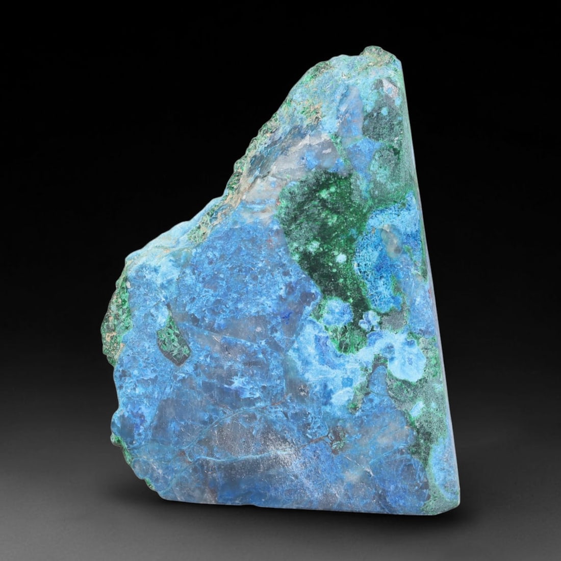76.13ct Natural Peruvian Chrysocolla Polished Slab Rough, 57EK: This partial-polished chrysocolla slab features blended mineral matrix with smooth refined face and unaltered natural rugged edge across its 40x29x6mm elongated form, translucent mineral layers hold s