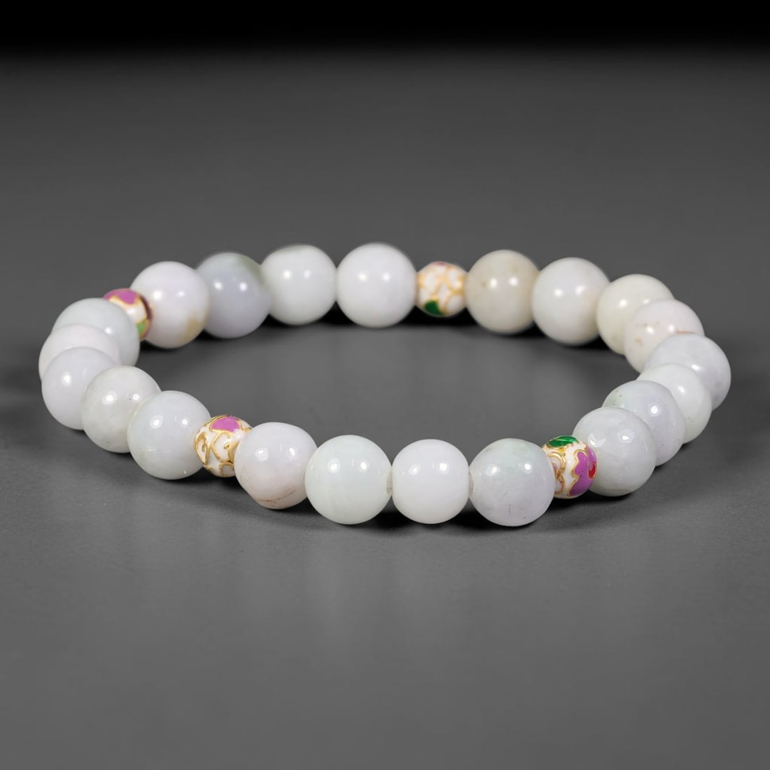 Natural Burmese Type A Jadeite Jade Beaded Bracelet, 12FJ: Made with polished natural jadeite jade round beads featuring soft pale natural tones. Each bead measures 9mm, strung as a flexible stretch bracelet. A minimalist elegant design ideal for daily wear, 