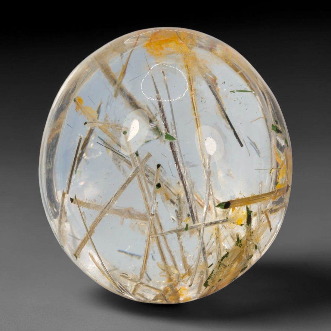 26ct Natural Brazilian Black Rutile Quartz Cabochon Loose Gemstone, 54BM: This polished cabochon of natural rutile quartz features countless distinct slender black rutile needle inclusions suspended within the clear quartz host crystal. The smooth domed surface enables full