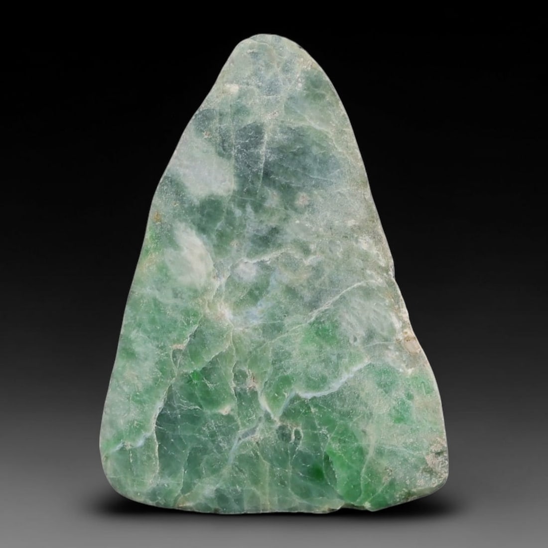 128ct Natural Type A Burmese Jadeite Jade Sliced Rough, 20AZ: This specimen is a sliced rough block of natural Type A Burmese jadeite jade. The interior displays natural colour zoning with visible mineral veining and crystalline patterns typical of unprocessed j