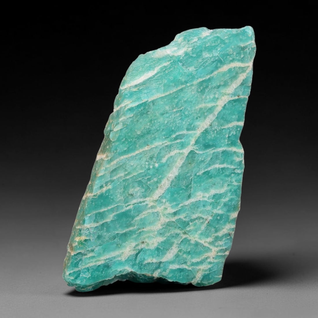 110ct Natural Russian Ural Amazonite Slab Rough, 92EB: This intact amazonite slab features distinct parallel mineral banding running uniformly across its naturally split flat surface within 50x29x7mm slab dimensions, retaining unmodified natural geologica