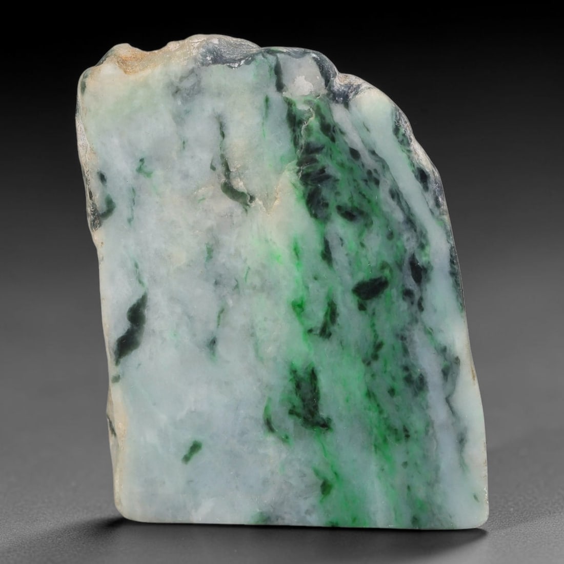 243ct Natural Type A Burmese Jadeite Jade Sliced Rough, 25FB: This specimen is a sliced rough block of natural Type A Burmese jadeite jade. The interior displays natural colour zoning with visible mineral veining and crystalline patterns typical of unprocessed j