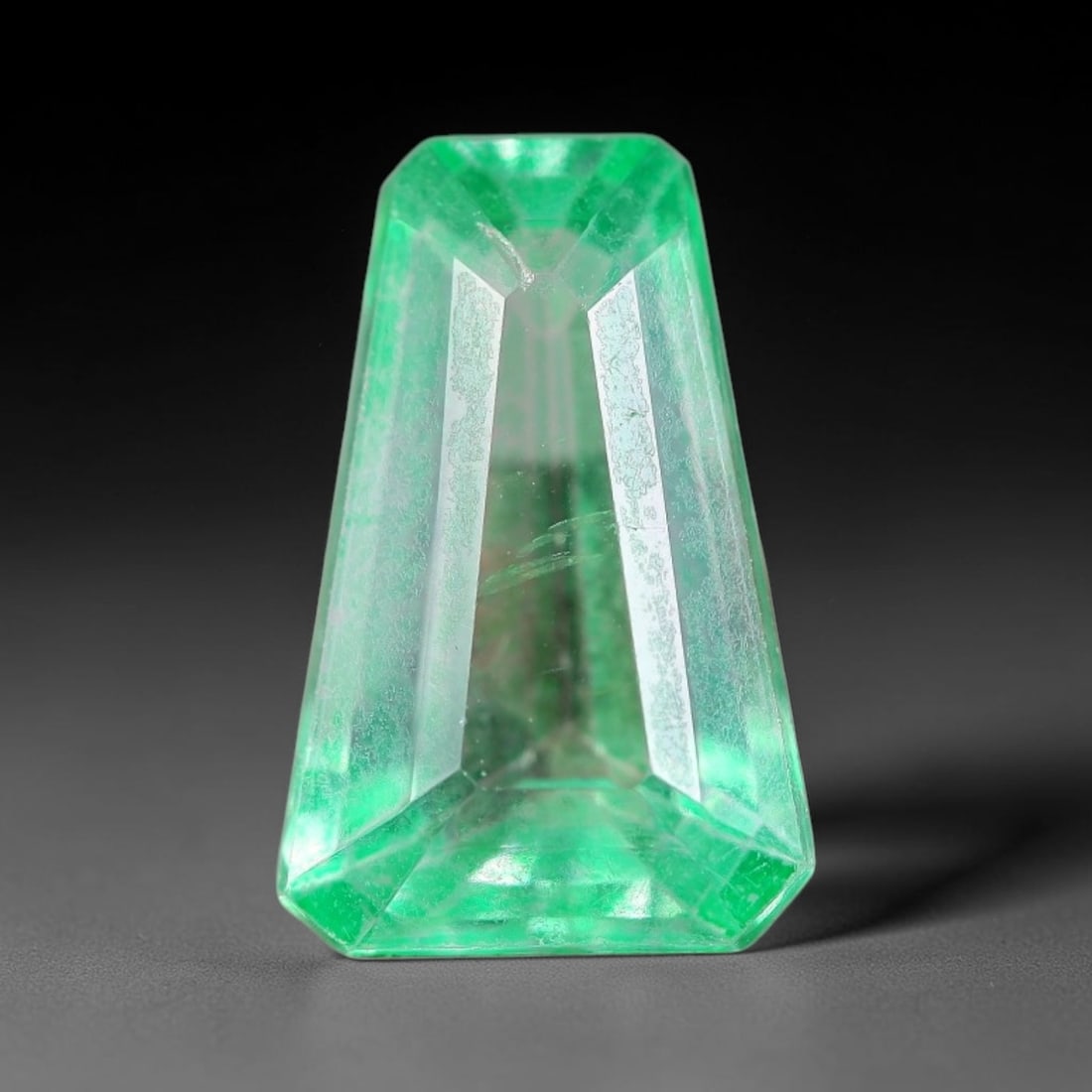 5.55 Carats Natural Brazil Vivid Green Topaz Loose Gemstone, 7FE: This natural Brazil topaz with recorded dimensions of 13.8x9x5.8mm, featuring a bright saturated green tone achieved via color coating treatment across the gem surface, with faint subtle natural inter