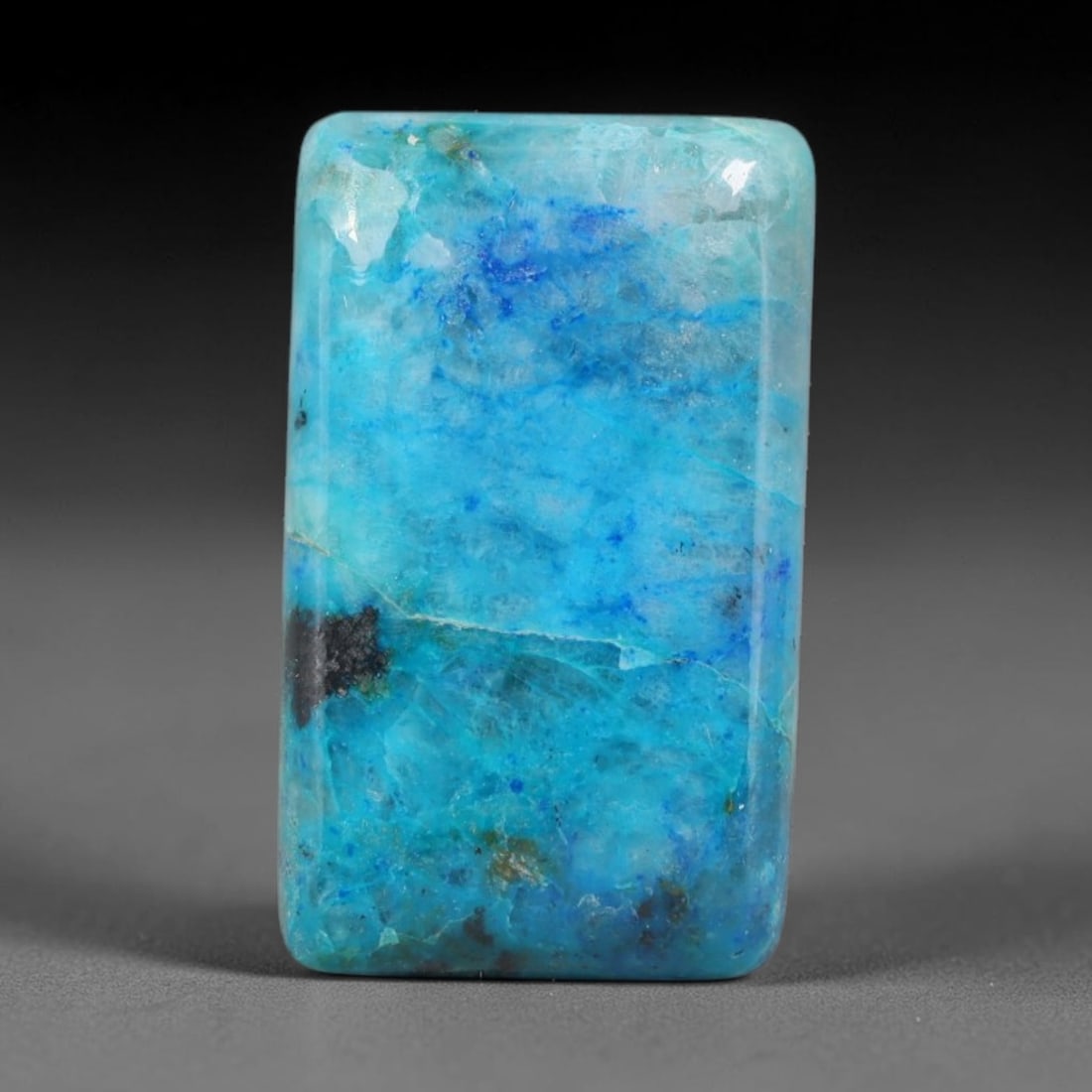 21ct Natural Peruvian Chrysocolla Cabochon Loose Gemstone, 4EQ: This natural chrysocolla cabochon from Peru displays beautiful blended mineral patterns across its smoothly polished surface. Dimensions measure 21x12x6mm, this wellfinished cabochon works wonderfully