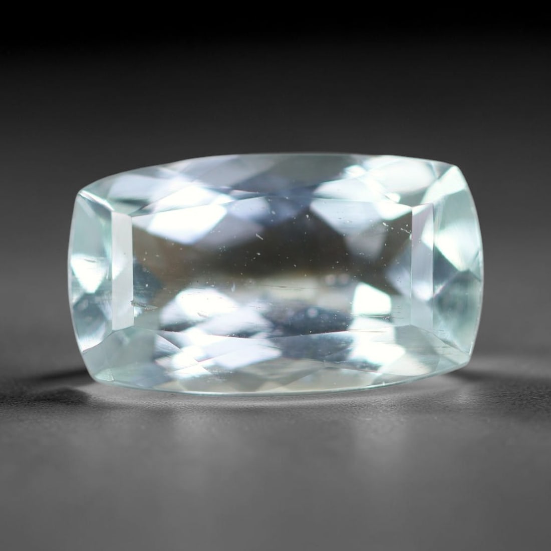2.28ct Natural Brazilian Sky Blue Faceted Aquamarine Loose Gemstone, 11BC: This precisely faceted aquamarine boasts clear translucent pale sky blue body tone with subtle thin mineral needle and tiny scattered crystalline specks visible within its polished reflective planes i