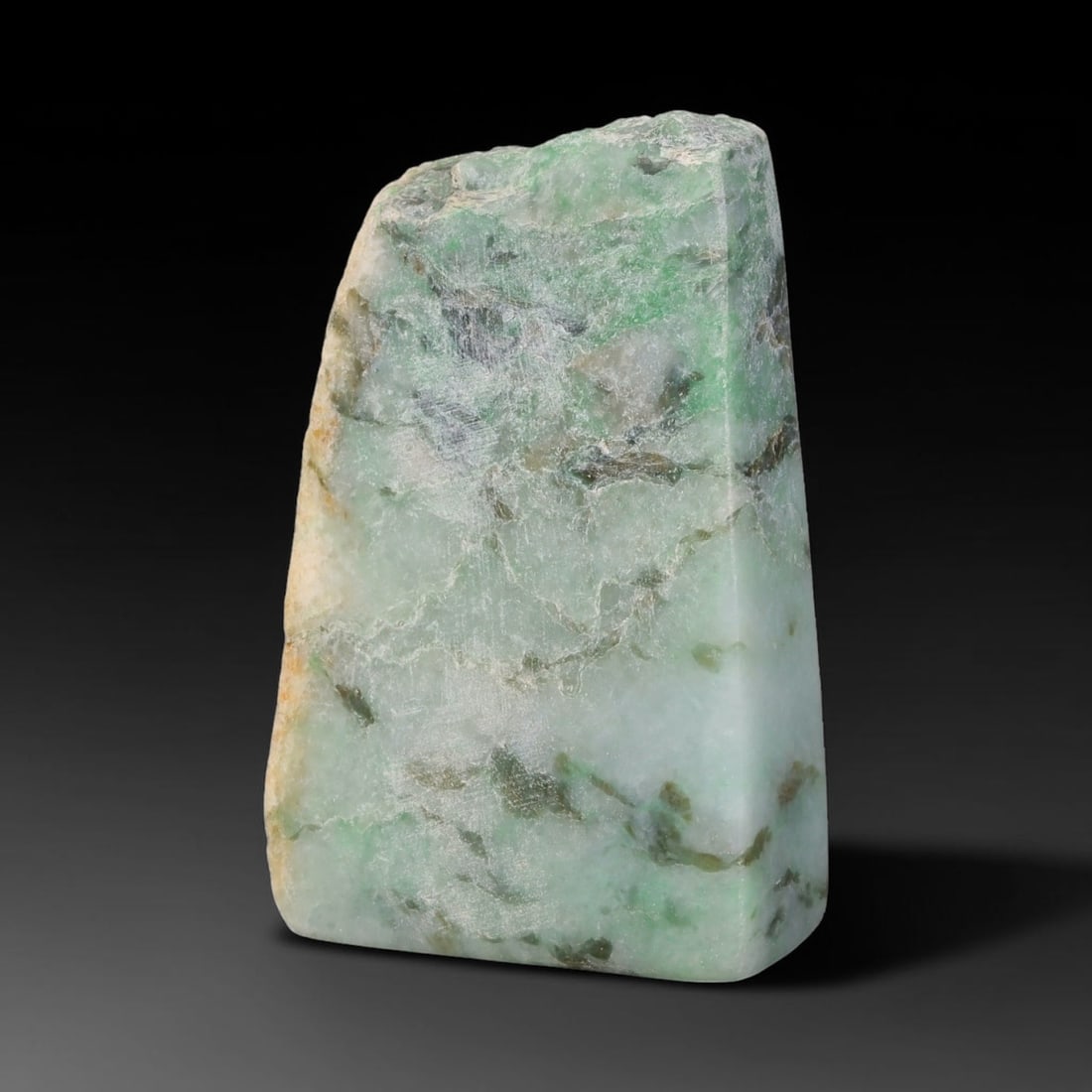 315ct Natural Type A Burmese Jadeite Jade Sliced Rough, 63FD: This specimen is a sliced rough block of natural Type A Burmese jadeite jade. The interior displays natural colour zoning with visible mineral veining and crystalline patterns typical of unprocessed j
