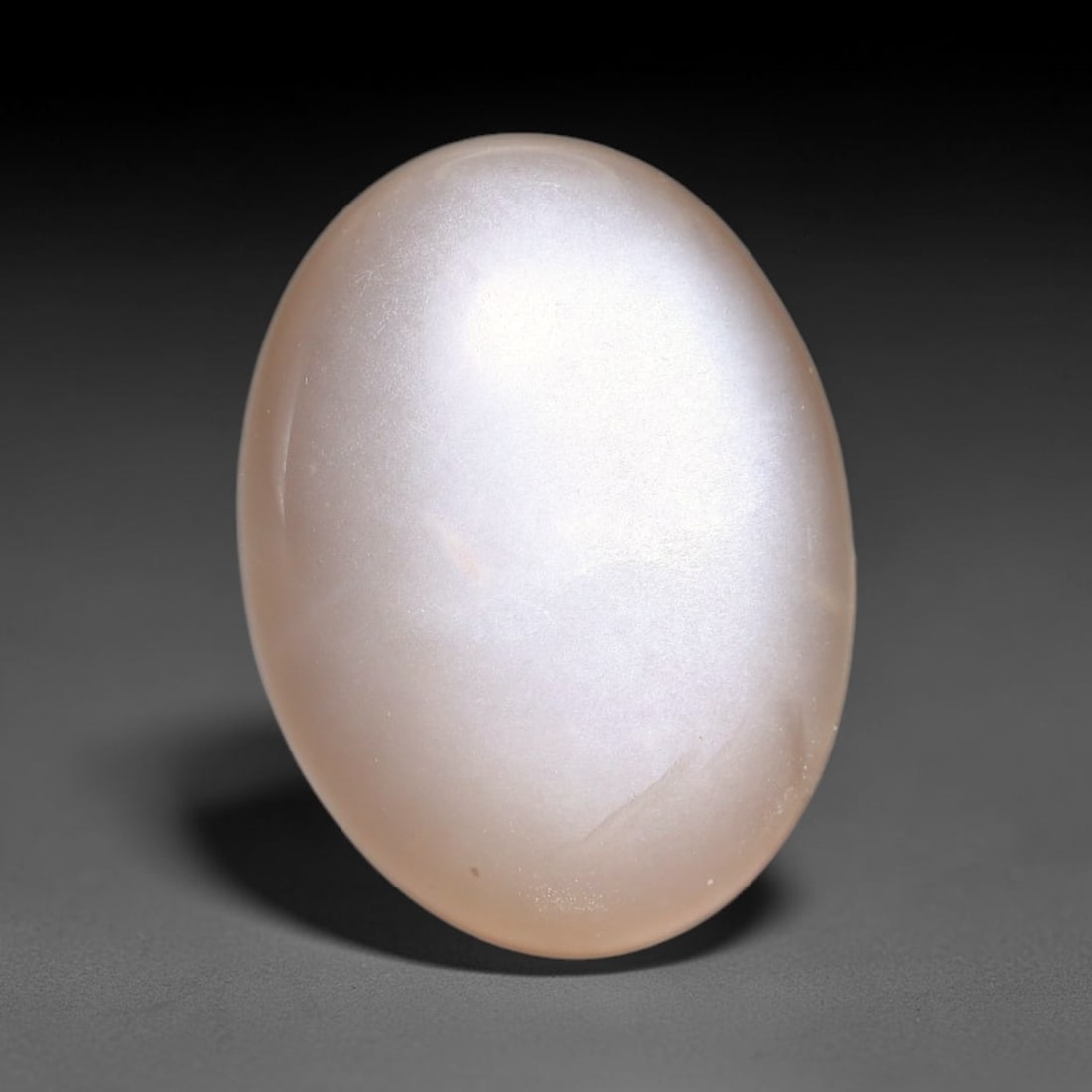 8.92ct Natural Ceylon Warm Peach Moonstone Loose Gemstone, 93FX: This natural Ceylon moonstone has dimension measurements of 15x11x6mm, showcasing a smooth warm peach base tone paired with subtle soft adularescent sheen that glides gently across the polished surfac