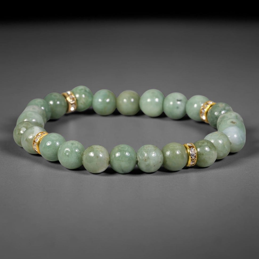 Natural Burmese Type A Jadeite Jade Beaded Bracelet, 29FJ: Constructed from polished natural jadeite jade round beads paired with decorative accent elements. The bracelet measures 8cm, assembled as a flexible wearable strand. Simple and elegant, suitable for 