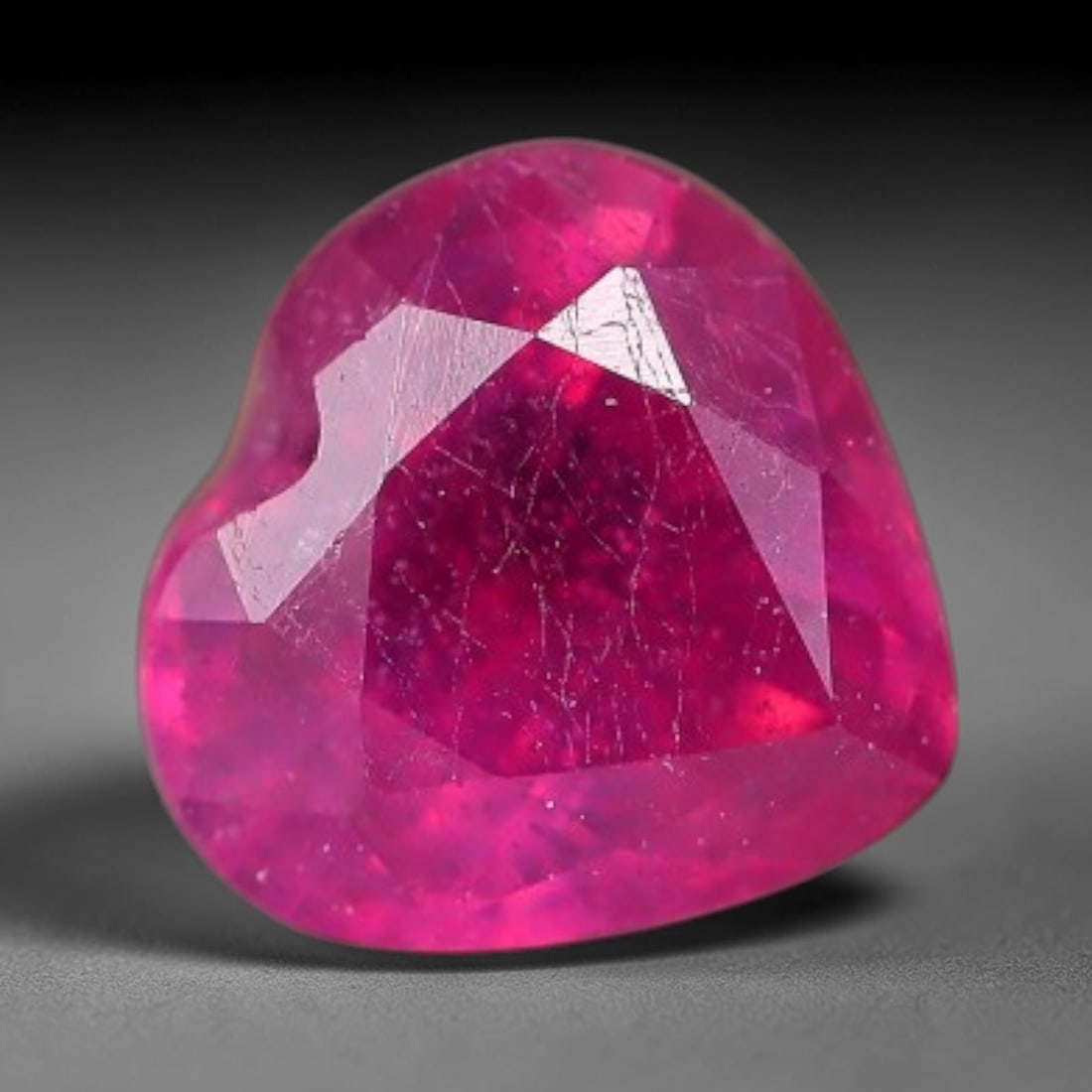 0.98 Carats Natural Madagascar Vivid Fuchsia Red Heated Ruby Loose Gemstone, 40FM: This vivid fuchsia red Madagascar ruby displays rich saturated red tone with subtle natural internal mineral traces that showcase genuine earth-grown character, measured at 6x5.8x3.5mm, the intense wa