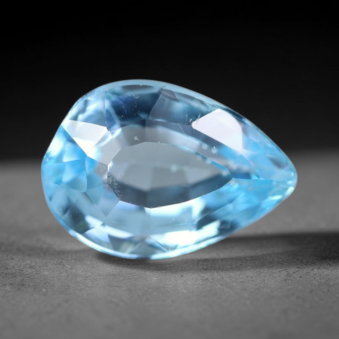 3.49ct Natural Brazilian Sky Blue Topaz Loose Gemstone, 55BE: This fully polished topaz exhibits clean bright sky-blue body tone, with faint microscopic natural crystal features visible inside its transparent structure, measured at calibrated dimensions of 11.2x