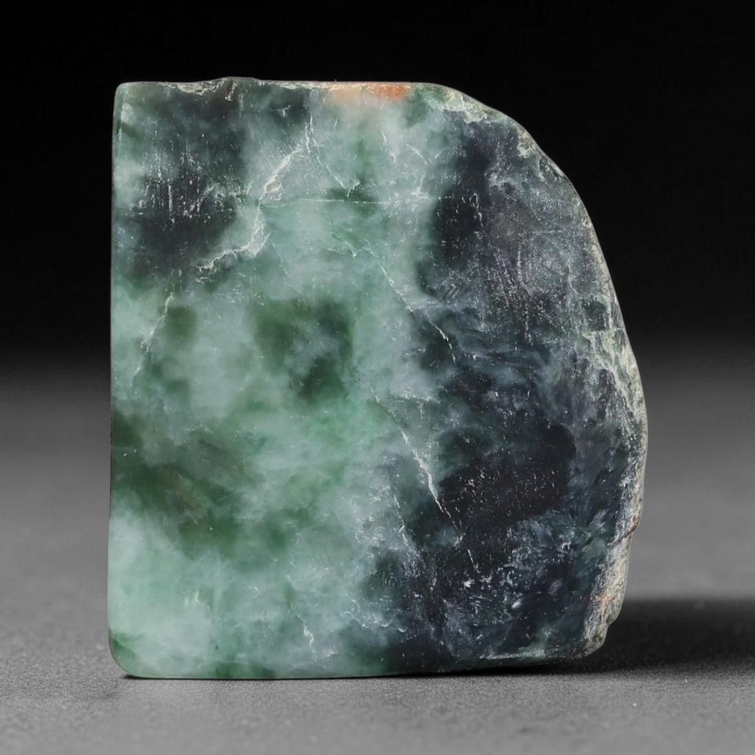 157ct Natural Type A Burmese Jadeite Jade Sliced Rough, 36FD: This specimen is a sliced rough block of natural Type A Burmese jadeite jade. The interior displays natural colour zoning with visible mineral veining and crystalline patterns typical of unprocessed j