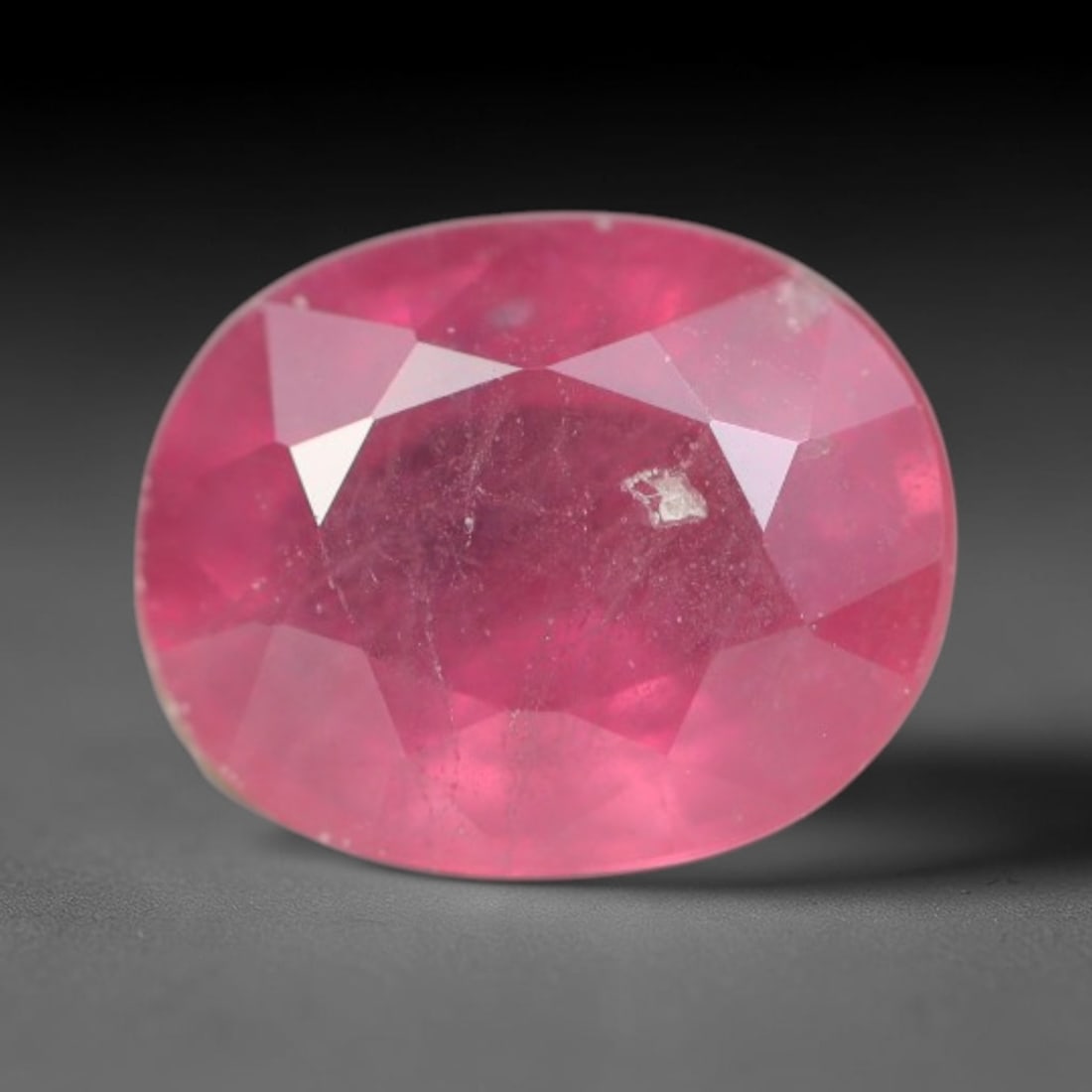 0.87ct Natural Sri Lankan Padparadscha Sapphire Loose Gemstone, 53BC: This fully polished Padparadscha sapphire carries warm blended peach-pink and soft orange body saturation, with subtle microscopic mineral flecks dispersed within its crystalline interior across its c