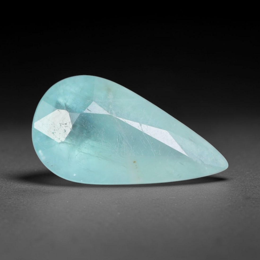 1.70ct Natural Madagascan Faceted Grandidierite Rare Loose Gemstone, 31AS: This expertly faceted finished grandidierite holds soft translucent body tone with fine faint natural internal veining visible beneath precisely cut reflective facets within its 12.2x6.5x4mm calibrate