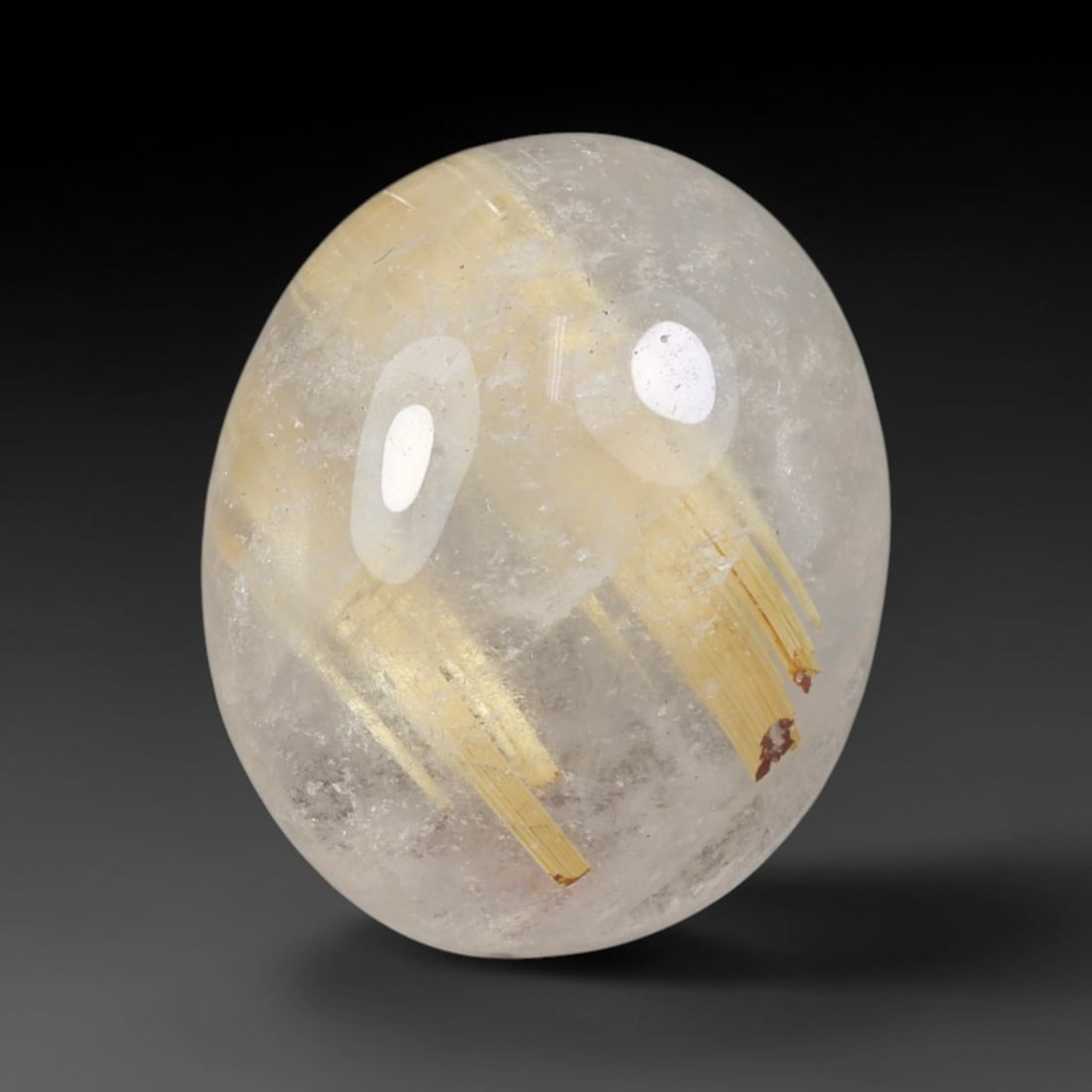 13.54 Carats Natural Brazil Golden Needle Rutile Quartz Loose Gemstone, 73FM: This Brazil golden needle rutile quartz cabochon measures 17.5x14.6x7.2mm, featuring prominent bright golden rutile needle inclusions scattered naturally throughout its clear transparent quartz base, 