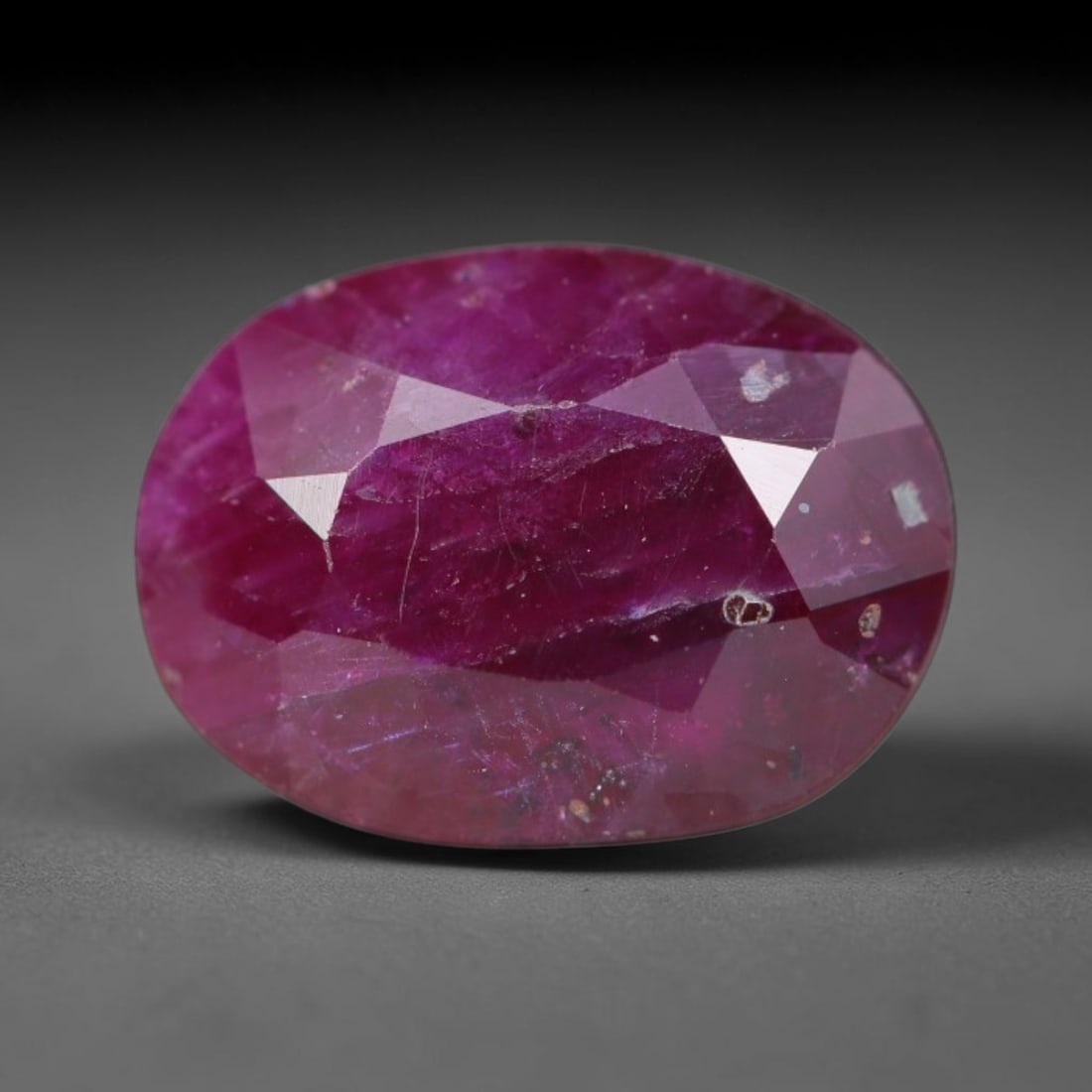 1.83ct Natural Tanzanian Longido Deep Crimson Red Faceted Ruby Loose Gemstone, 75BC: This expertly faceted Longido ruby features a rich deep crimson red body tone with distinct natural linear mineral striations, scattered pale mineral deposits and minor dark mineral flecks visible wit