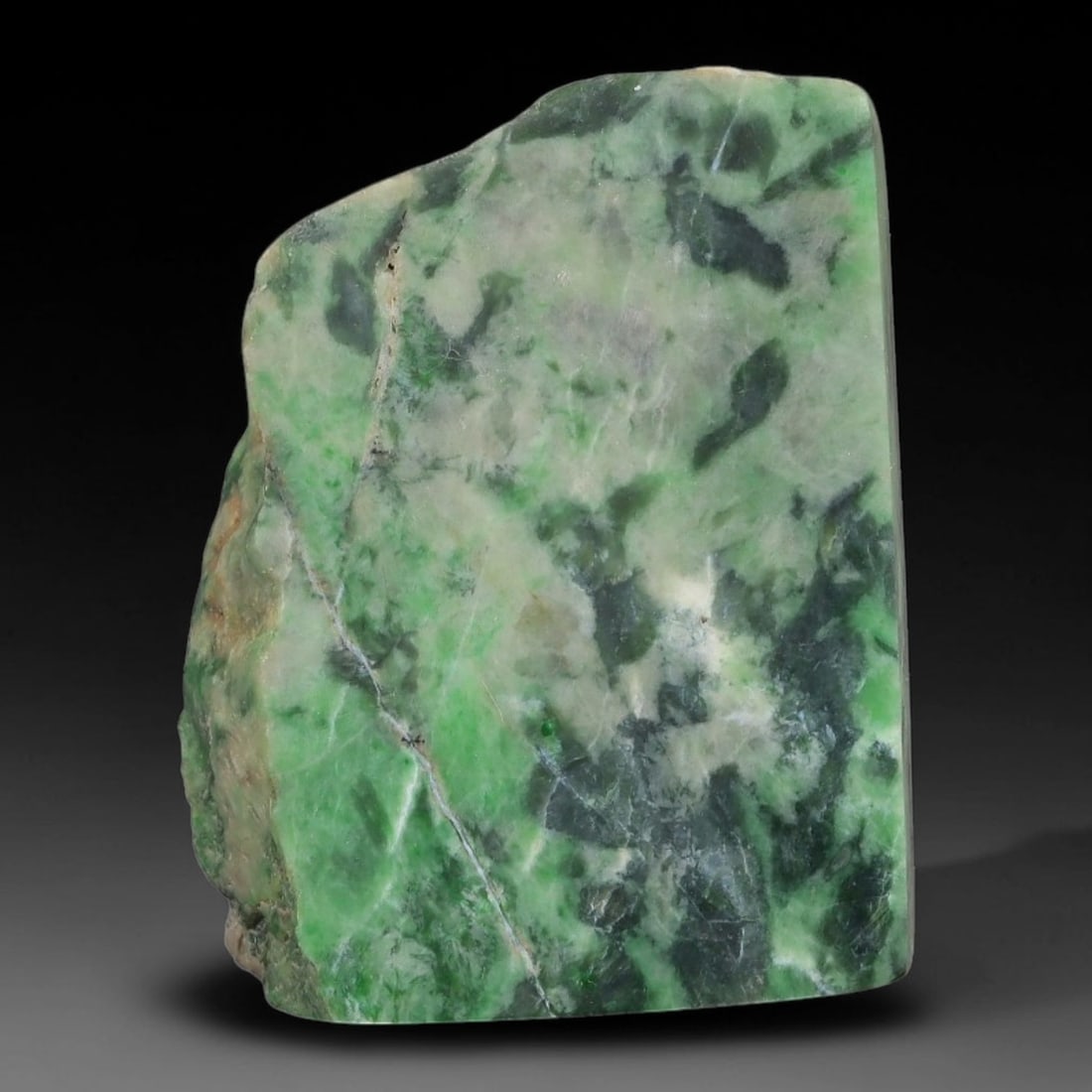 120ct Natural Type A Burmese Jadeite Jade Sliced Rough, 25AZ: This specimen is a sliced rough block of natural Type A Burmese jadeite jade. The interior displays natural colour zoning with visible mineral veining and crystalline patterns typical of unprocessed j