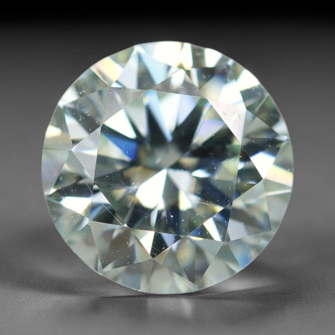 2.46 Carats Natural Cool White Moissanite Loose Gemstone, 19FL: This cool white moissanite holds dimension measurements of 9x5.4mm, delivering exceptional light dispersion that generates vivid rainbow sparkle across its fully transparent body, with faint microscop