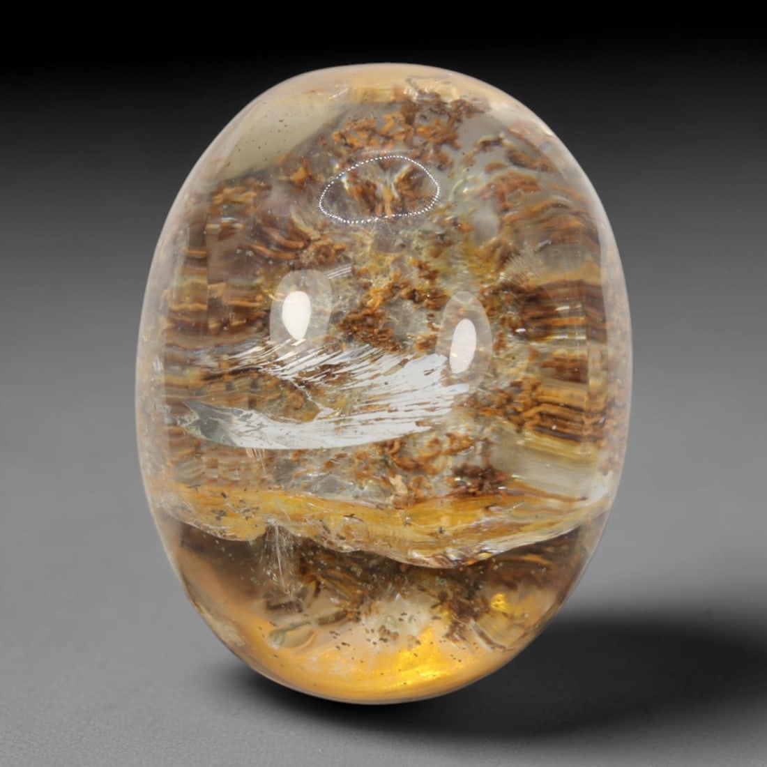 31ct Natural Brazilian Phantom Quartz Oval Cabochon Loose Gemstone, 5BM: This smoothly polished cabochon of natural phantom quartz preserves delicate layered phantom crystal formations enclosed inside transparent quartz host. The domed polished surface offers unobstructed 