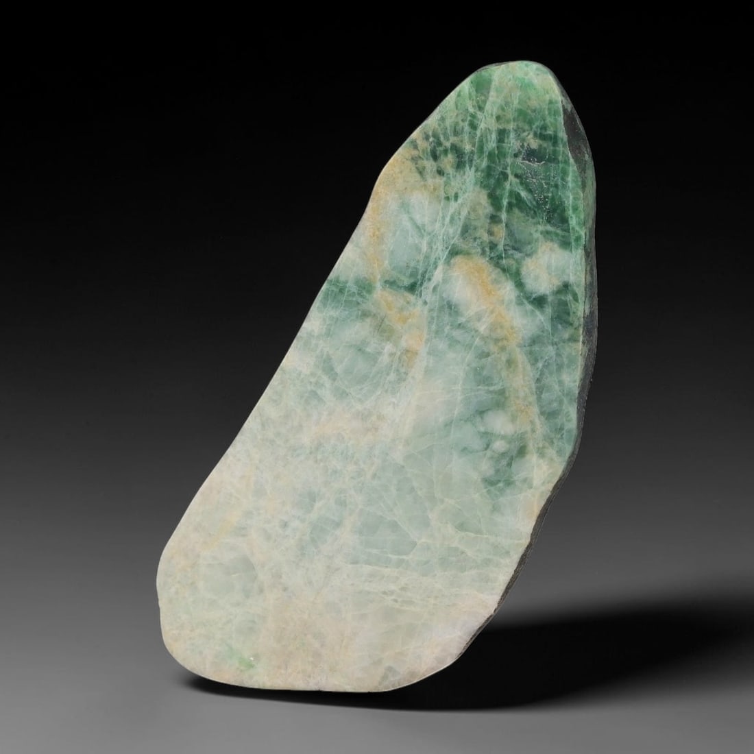 263ct Natural Type A Burmese Jadeite Jade Sliced Rough, 5AZ: This specimen is a sliced rough block of natural Type A Burmese jadeite jade. The interior displays natural colour zoning with visible mineral veining and crystalline patterns typical of unprocessed j