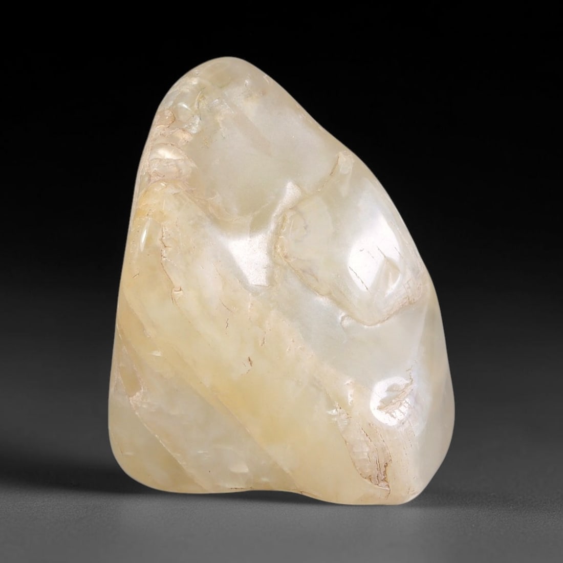 60ct Natural Ceylon Pale Cream White Moonstone Rough, 67AH: This smooth weathered moonstone rough carries soft pale cream white translucency with subtle internal silvery adularescent shimmer locked within its naturally tumbled surface, fine faint mineral veini
